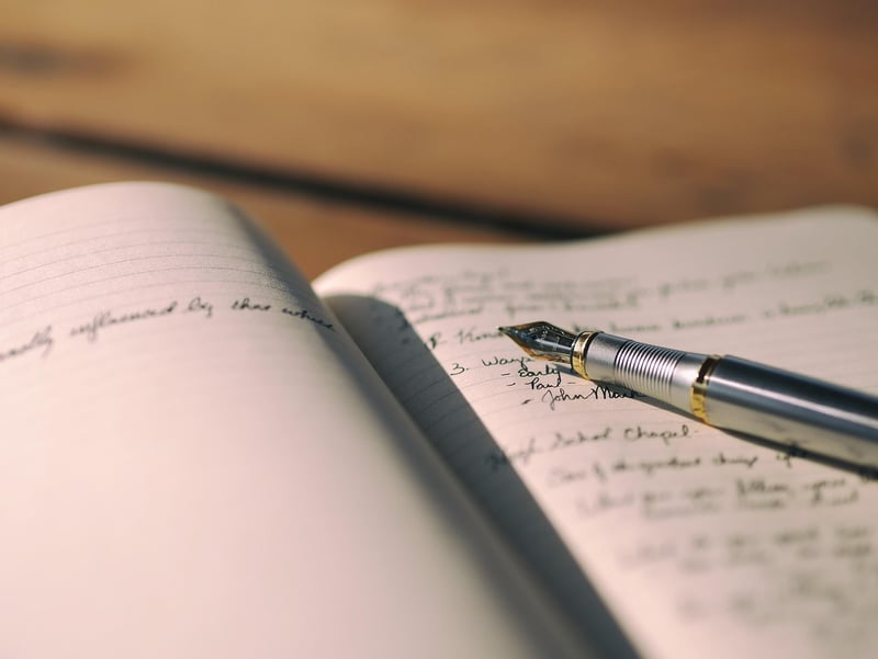 Person writing in a journal